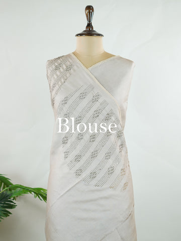 Tussar Tussar saree in a graceful grey shade with hand embroidery reflects subtle elegance and charm. The intricate hand-embroidered detailing adds a refined touch of traditional artistry.br data-start=183 data-end=186Its soft grey tone enhances the saree’s calm and sophisticated appeal. Paired with a matching grey blouse, it creates a timeless and graceful ethnic look. Mahika - Tussar Silk Saree | Hand Embroidered - Manoranjitham Weaves - Handloom Store