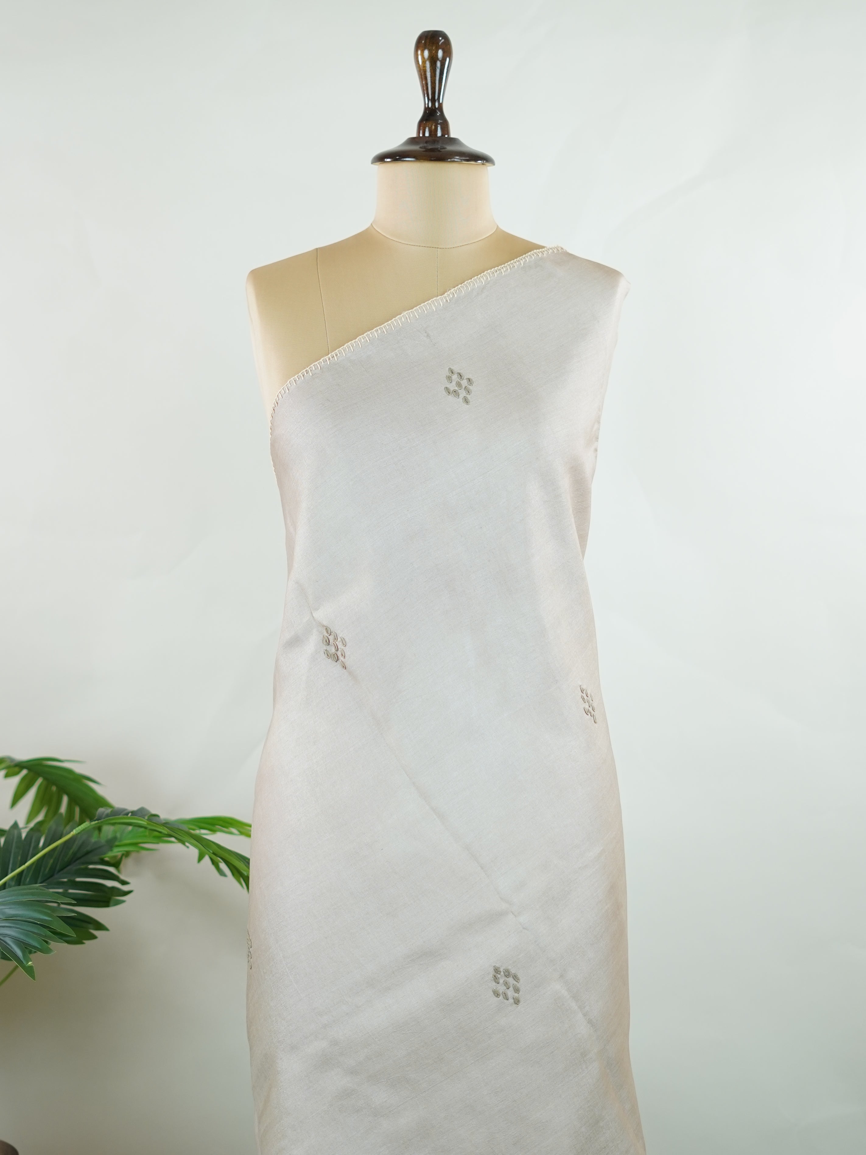 Tussar Tussar saree in a graceful grey shade with hand embroidery reflects subtle elegance and charm. The intricate hand-embroidered detailing adds a refined touch of traditional artistry.br data-start=183 data-end=186Its soft grey tone enhances the saree’s calm and sophisticated appeal. Paired with a matching grey blouse, it creates a timeless and graceful ethnic look. Mahika - Tussar Silk Saree | Hand Embroidered - Manoranjitham Weaves - Handloom Store
