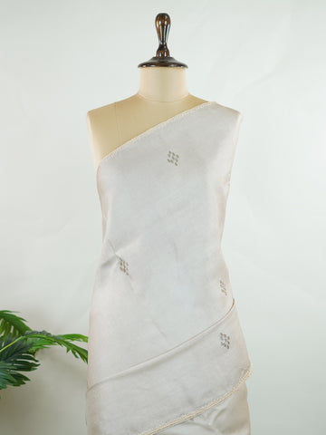 Tussar Tussar saree in a graceful grey shade with hand embroidery reflects subtle elegance and charm. The intricate hand-embroidered detailing adds a refined touch of traditional artistry.br data-start=183 data-end=186Its soft grey tone enhances the saree’s calm and sophisticated appeal. Paired with a matching grey blouse, it creates a timeless and graceful ethnic look. Mahika - Tussar Silk Saree | Hand Embroidered - Manoranjitham Weaves - Handloom Store