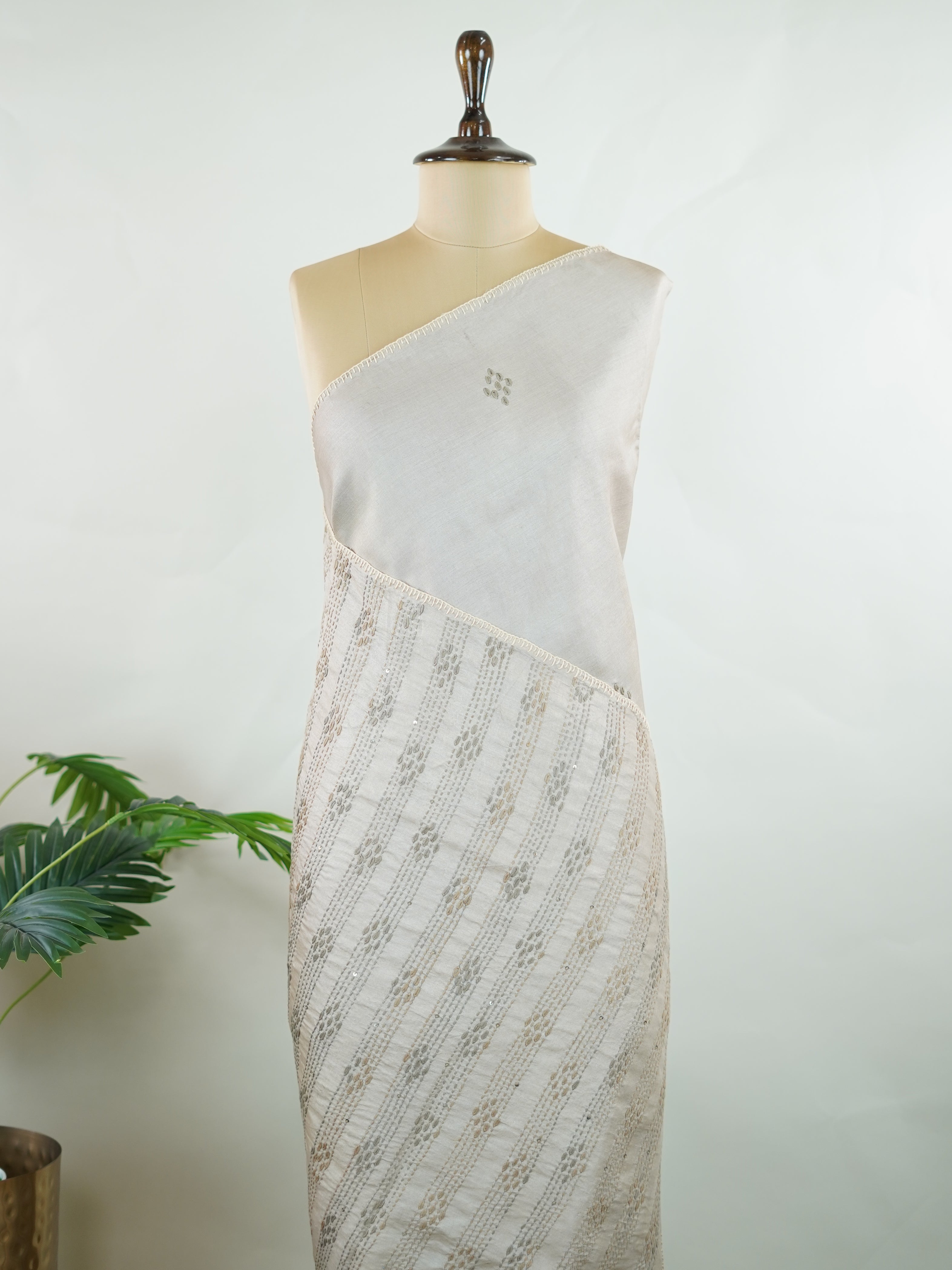 Tussar Tussar saree in a graceful grey shade with hand embroidery reflects subtle elegance and charm. The intricate hand-embroidered detailing adds a refined touch of traditional artistry.br data-start=183 data-end=186Its soft grey tone enhances the saree’s calm and sophisticated appeal. Paired with a matching grey blouse, it creates a timeless and graceful ethnic look. Mahika - Tussar Silk Saree | Hand Embroidered - Manoranjitham Weaves - Handloom Store