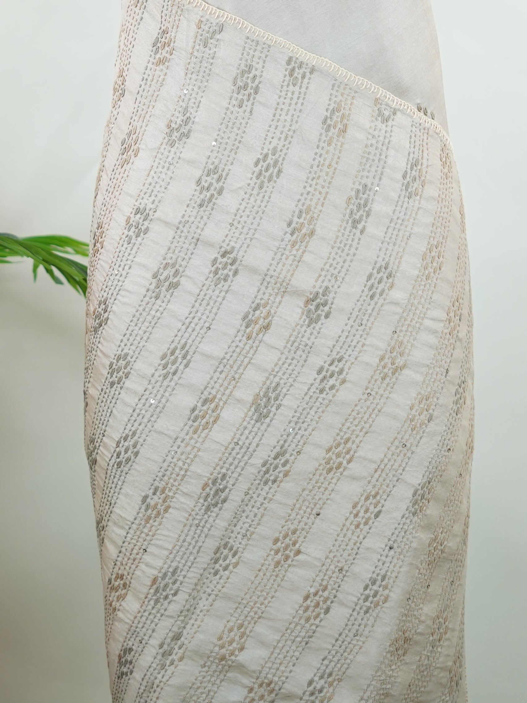 Tussar Tussar saree in a graceful grey shade with hand embroidery reflects subtle elegance and charm. The intricate hand-embroidered detailing adds a refined touch of traditional artistry.br data-start=183 data-end=186Its soft grey tone enhances the saree’s calm and sophisticated appeal. Paired with a matching grey blouse, it creates a timeless and graceful ethnic look. Mahika - Tussar Silk Saree | Hand Embroidered - Manoranjitham Weaves - Handloom Store