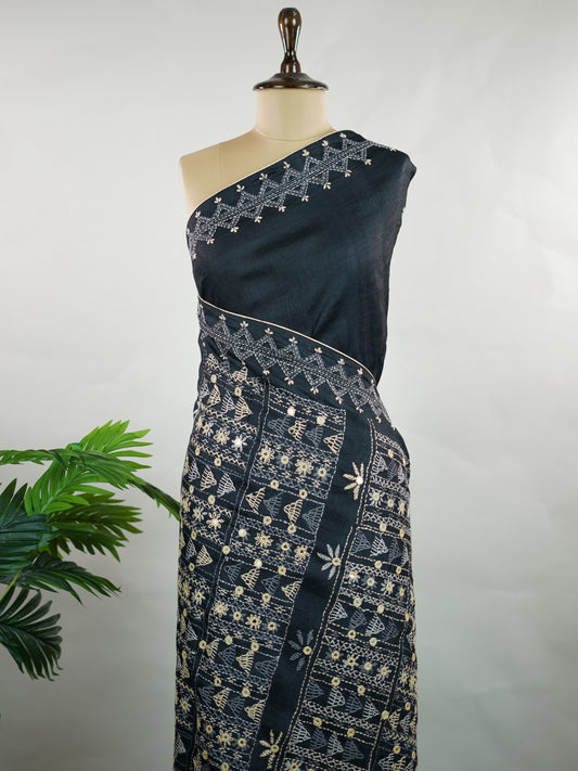 Tussar Striking Lambani embroidery on the border and pallu elevates this Tussar silk saree into a grand statement piece. Intricate tribal motifs, vibrant threads, and signature mirror work beautifully enhance the rich texture of Tussar.

Bold, artistic, and heritage-inspired—perfect for festive occasions and standout celebrations. Mohana - Manoranjitham Weaves - Handloom Store