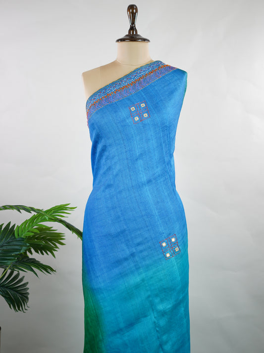 Tussar Rich Kutch embroidery beautifully highlights the heavy pallu with vibrant threads, intricate motifs, and signature mirror work, adding grandeur to the natural elegance of Tussar silk.

Balanced with a simple, subtly finished blouse, this saree creates the perfect blend of bold craftsmanship and graceful sophistication—ideal for festive and special occasions. Kameshi - Manoranjitham Weaves - Handloom Store