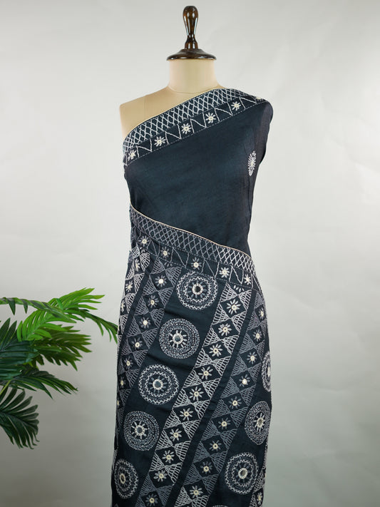 Tussar Rich Kutch embroidery beautifully highlights the heavy pallu with vibrant threads, intricate motifs, and signature mirror work, adding grandeur to the natural elegance of Tussar silk.

Balanced with a simple, subtly finished blouse, this saree creates the perfect blend of bold craftsmanship and graceful sophistication—ideal for festive and special occasions. Varnini - Manoranjitham Weaves - Handloom Store