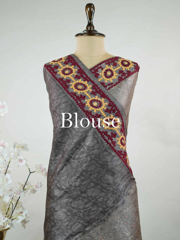 Tussar A refined Tussar saree in a rich grey base, highlighted with striking red accents for a bold contrast.br
Adorned with intricate Kutch embroidery, it celebrates vibrant craftsmanship with a timeless appeal. Priya - Grey Tussar Silk Saree | Kutch Work - Manoranjitham Weaves - Handloom Store