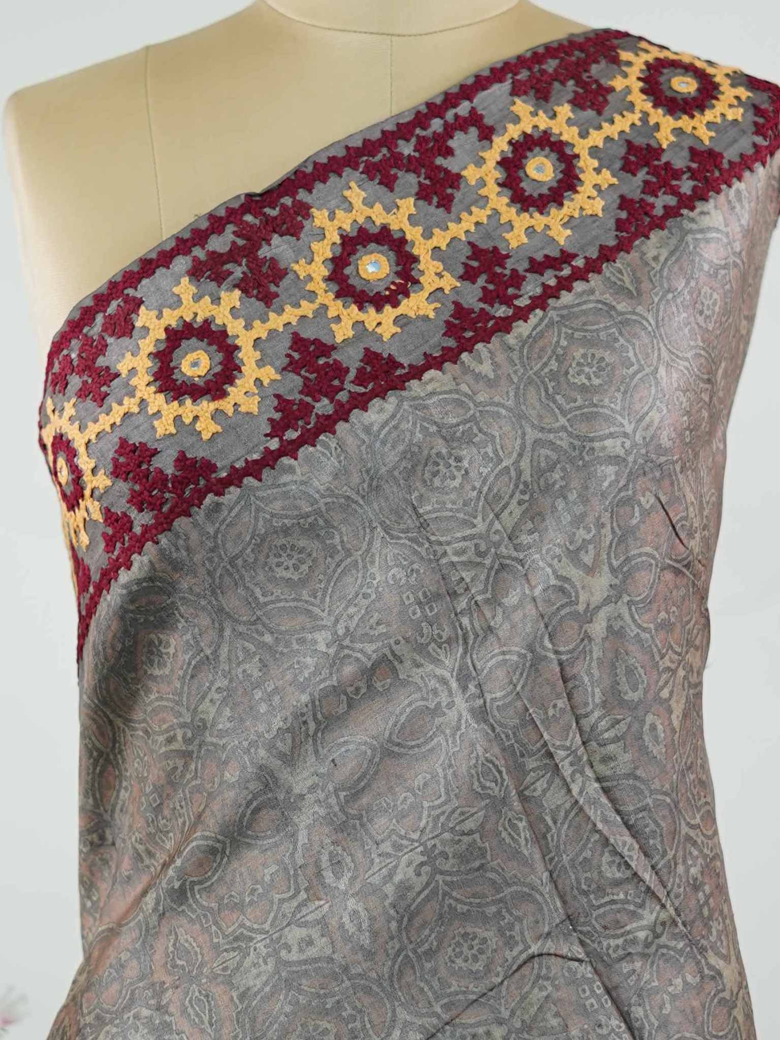 Tussar A refined Tussar saree in a rich grey base, highlighted with striking red accents for a bold contrast.br
Adorned with intricate Kutch embroidery, it celebrates vibrant craftsmanship with a timeless appeal. Priya - Grey Tussar Silk Saree | Kutch Work - Manoranjitham Weaves - Handloom Store