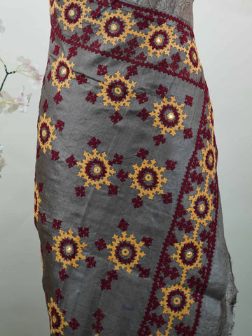 Tussar A refined Tussar saree in a rich grey base, highlighted with striking red accents for a bold contrast.br
Adorned with intricate Kutch embroidery, it celebrates vibrant craftsmanship with a timeless appeal. Priya - Grey Tussar Silk Saree | Kutch Work - Manoranjitham Weaves - Handloom Store