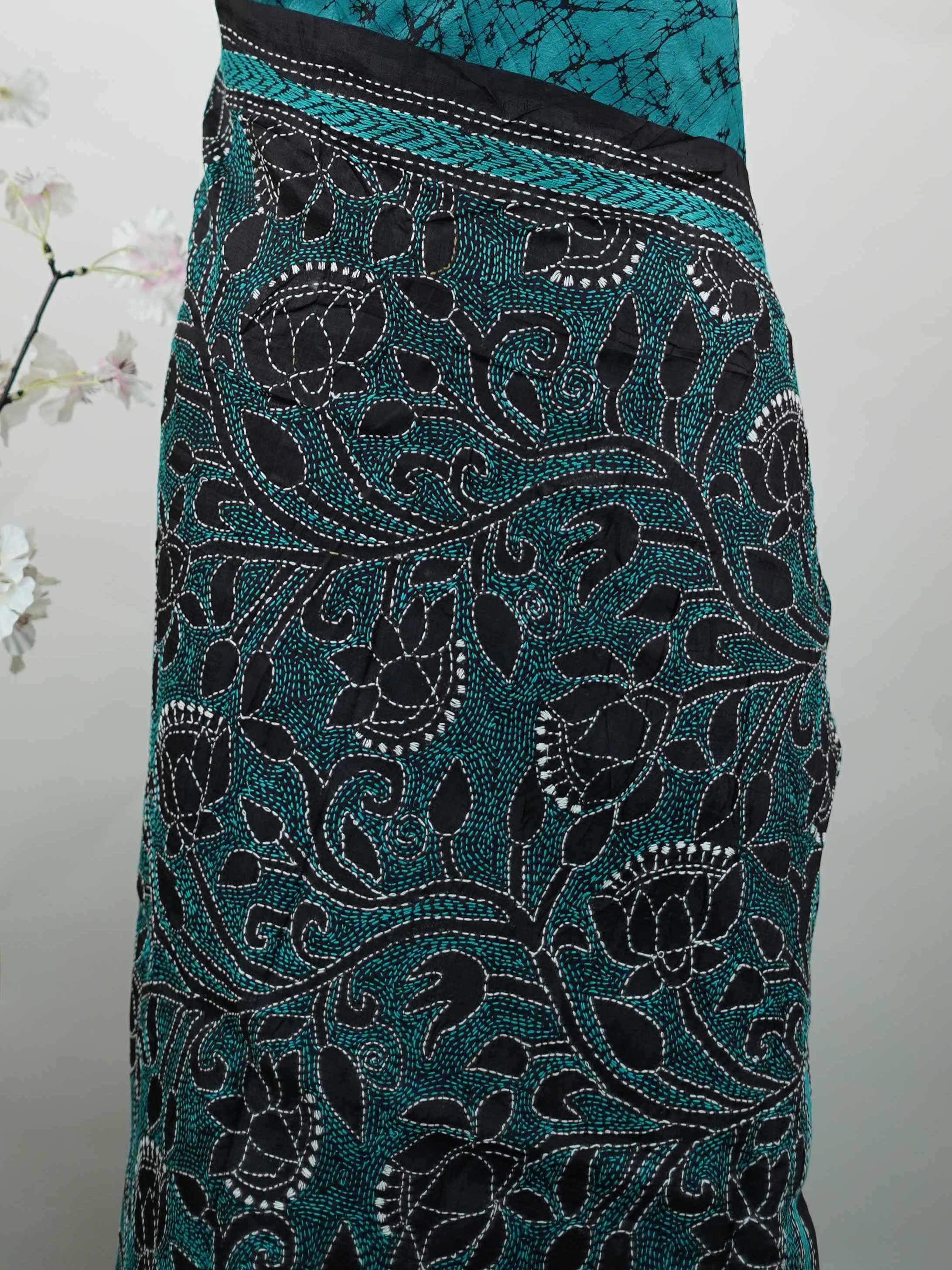 Tussar A striking blue soft silk saree paired with deep black accents, creating a bold and elegant contrast.br
Detailed with fine Kantha stitching and modern digital prints, it beautifully blends heritage craft with contemporary style. Varuni - Tussar Silk Saree | Kantha Embroidery - Manoranjitham Weaves - Handloom Store