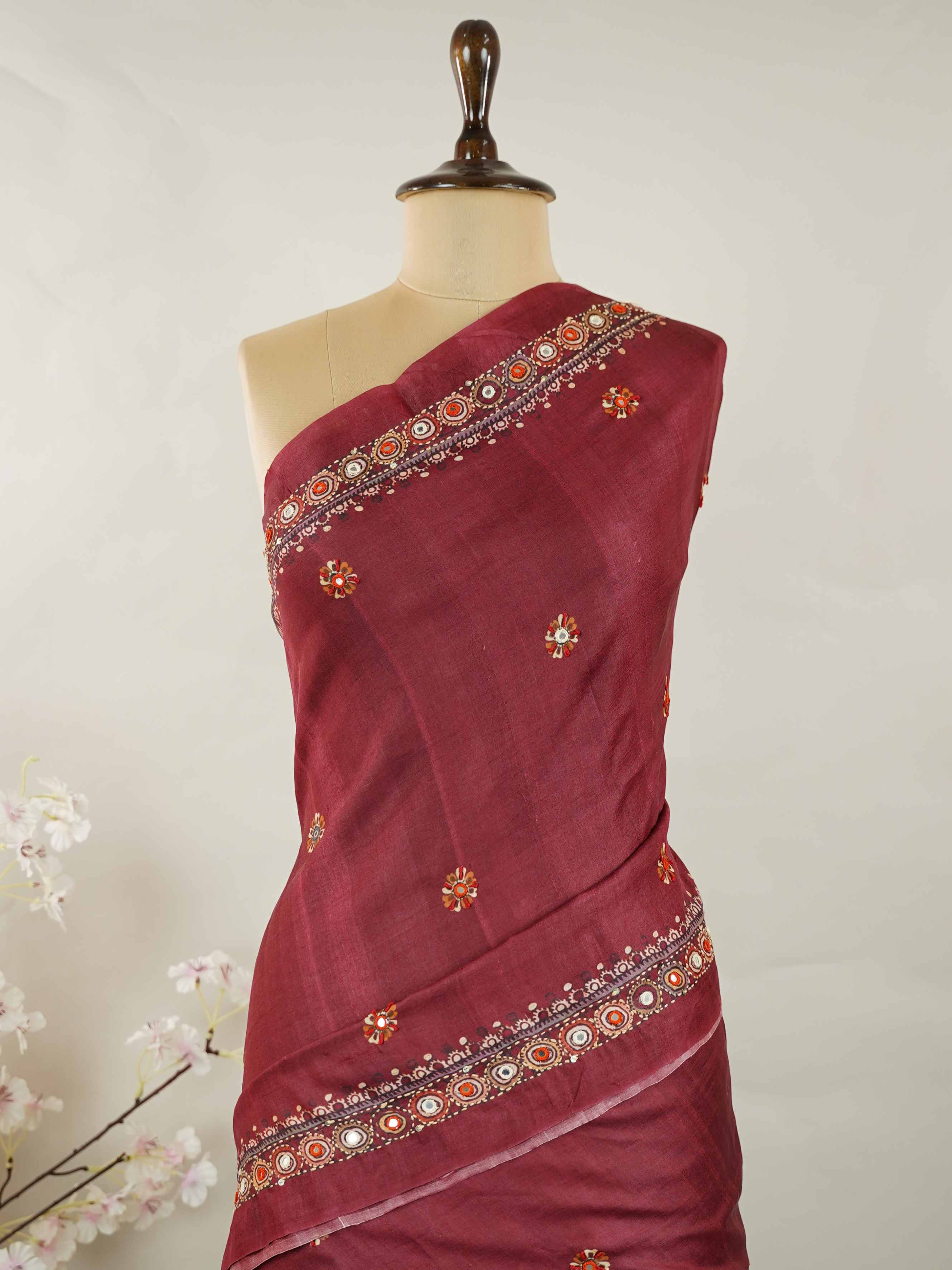Tussar Maroon Tussar silk body paired with a serene cream pallu and blouse, highlighted by intricate Radha Krishna embroidery.br
A graceful harmony of devotion and contrast, blending rich tones with timeless artistry. Kishori - Maroon Tussar Silk Saree | Radha Krishna Embroidery - Manoranjitham Weaves - Handloom Store