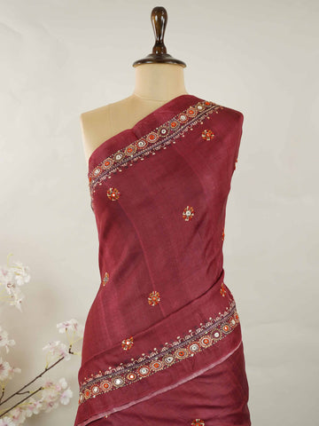 Tussar Maroon Tussar silk body paired with a serene cream pallu and blouse, highlighted by intricate Radha Krishna embroidery.br
A graceful harmony of devotion and contrast, blending rich tones with timeless artistry. Kishori - Maroon Tussar Silk Saree | Radha Krishna Embroidery - Manoranjitham Weaves - Handloom Store