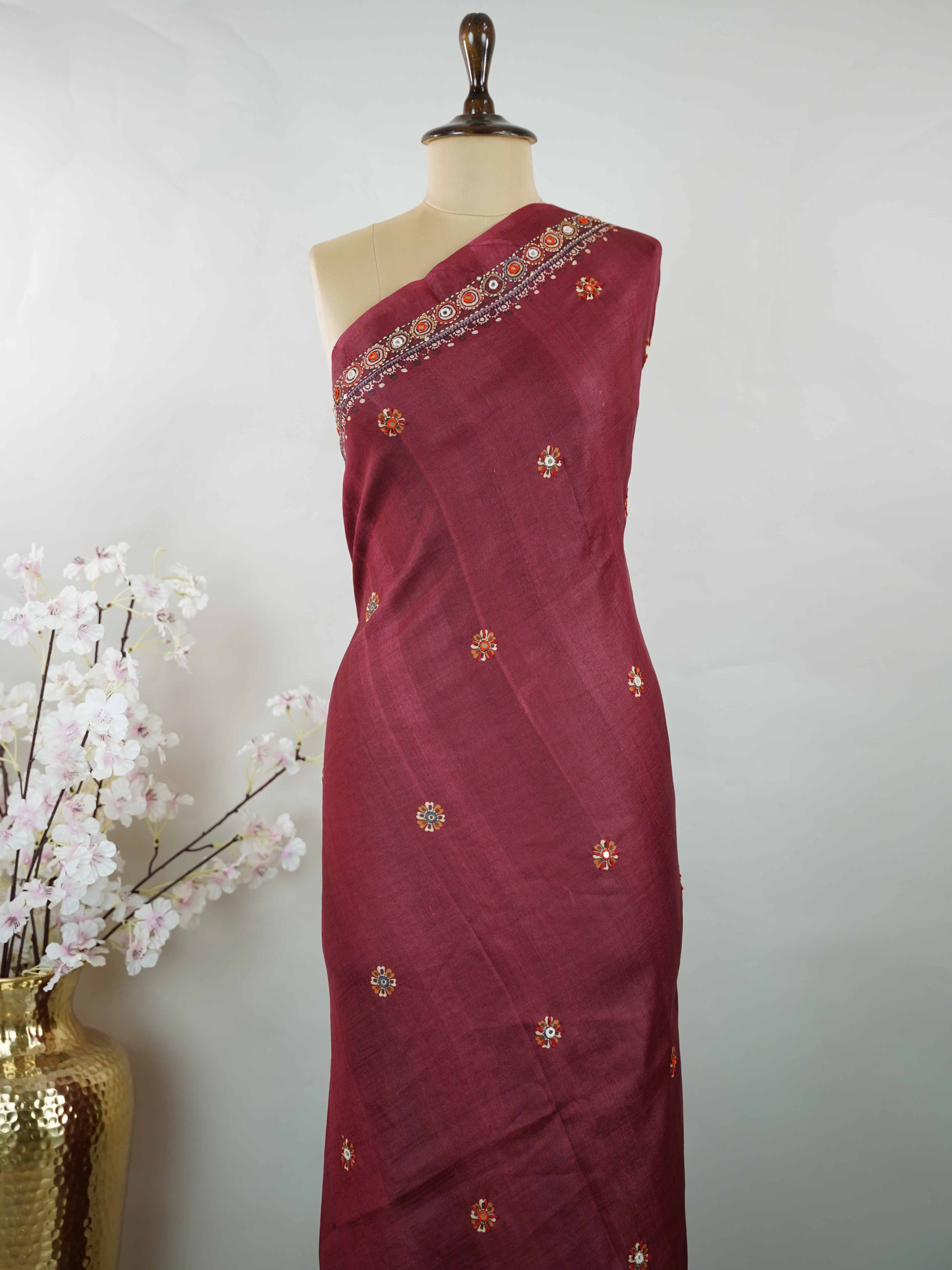 Tussar Maroon Tussar silk body paired with a serene cream pallu and blouse, highlighted by intricate Radha Krishna embroidery.br
A graceful harmony of devotion and contrast, blending rich tones with timeless artistry. Kishori - Maroon Tussar Silk Saree | Radha Krishna Embroidery - Manoranjitham Weaves - Handloom Store