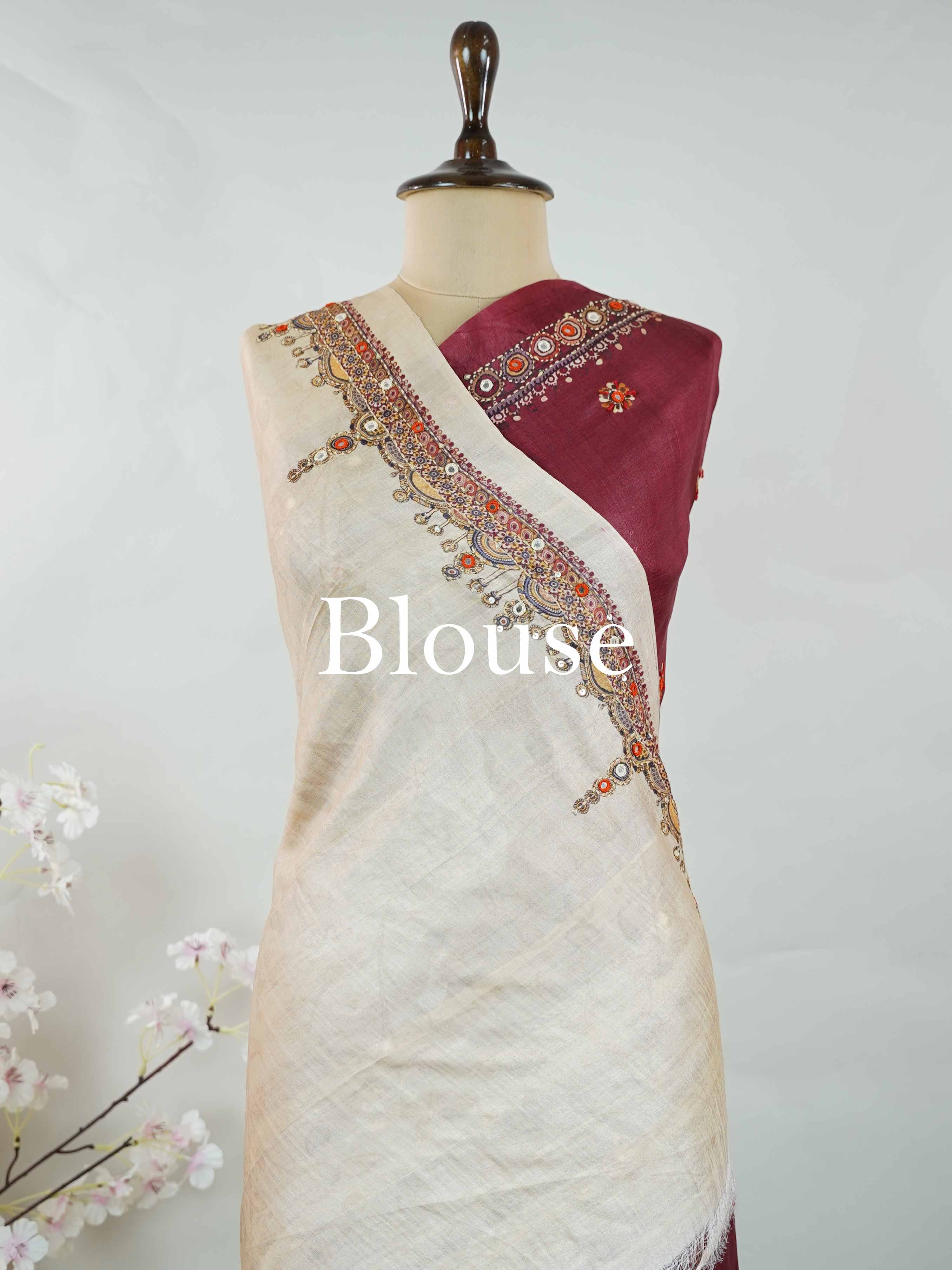 Tussar Maroon Tussar silk body paired with a serene cream pallu and blouse, highlighted by intricate Radha Krishna embroidery.br
A graceful harmony of devotion and contrast, blending rich tones with timeless artistry. Kishori - Maroon Tussar Silk Saree | Radha Krishna Embroidery - Manoranjitham Weaves - Handloom Store