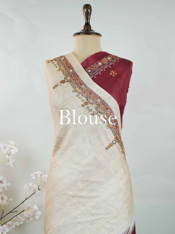 Tussar Maroon Tussar silk body paired with a serene cream pallu and blouse, highlighted by intricate Radha Krishna embroidery.br
A graceful harmony of devotion and contrast, blending rich tones with timeless artistry. Kishori - Maroon Tussar Silk Saree | Radha Krishna Embroidery - Manoranjitham Weaves - Handloom Store