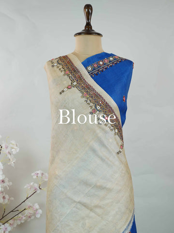 Tussar Ink blue Tussar silk body paired with a serene cream pallu and blouse, highlighted by intricate Radha Krishna embroidery.br
A graceful harmony of devotion and contrast, blending deep hues with timeless artistry. Shyama - Ink Blue Tussar Silk Saree | Radha Krishna Embroidery - Manoranjitham Weaves - Handloom Store