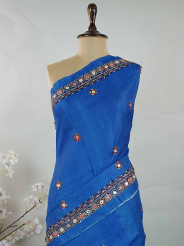 Tussar Ink blue Tussar silk body paired with a serene cream pallu and blouse, highlighted by intricate Radha Krishna embroidery.br
A graceful harmony of devotion and contrast, blending deep hues with timeless artistry. Shyama - Ink Blue Tussar Silk Saree | Radha Krishna Embroidery - Manoranjitham Weaves - Handloom Store