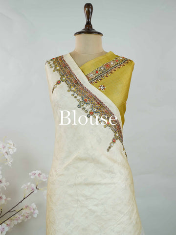 Tussar Mustard green Tussar silk body paired with a serene cream pallu and blouse, highlighted by intricate Radha Krishna embroidery.br
A graceful harmony of earthy vibrance and devotion, woven into timeless artistry. Narayani - Mustard Green Tussar Silk Saree | Radha Krishna Embroidery - Manoranjitham Weaves - Handloom Store