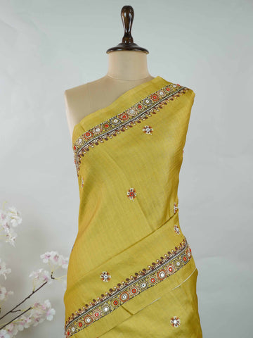 Tussar Mustard green Tussar silk body paired with a serene cream pallu and blouse, highlighted by intricate Radha Krishna embroidery.br
A graceful harmony of earthy vibrance and devotion, woven into timeless artistry. Narayani - Mustard Green Tussar Silk Saree | Radha Krishna Embroidery - Manoranjitham Weaves - Handloom Store