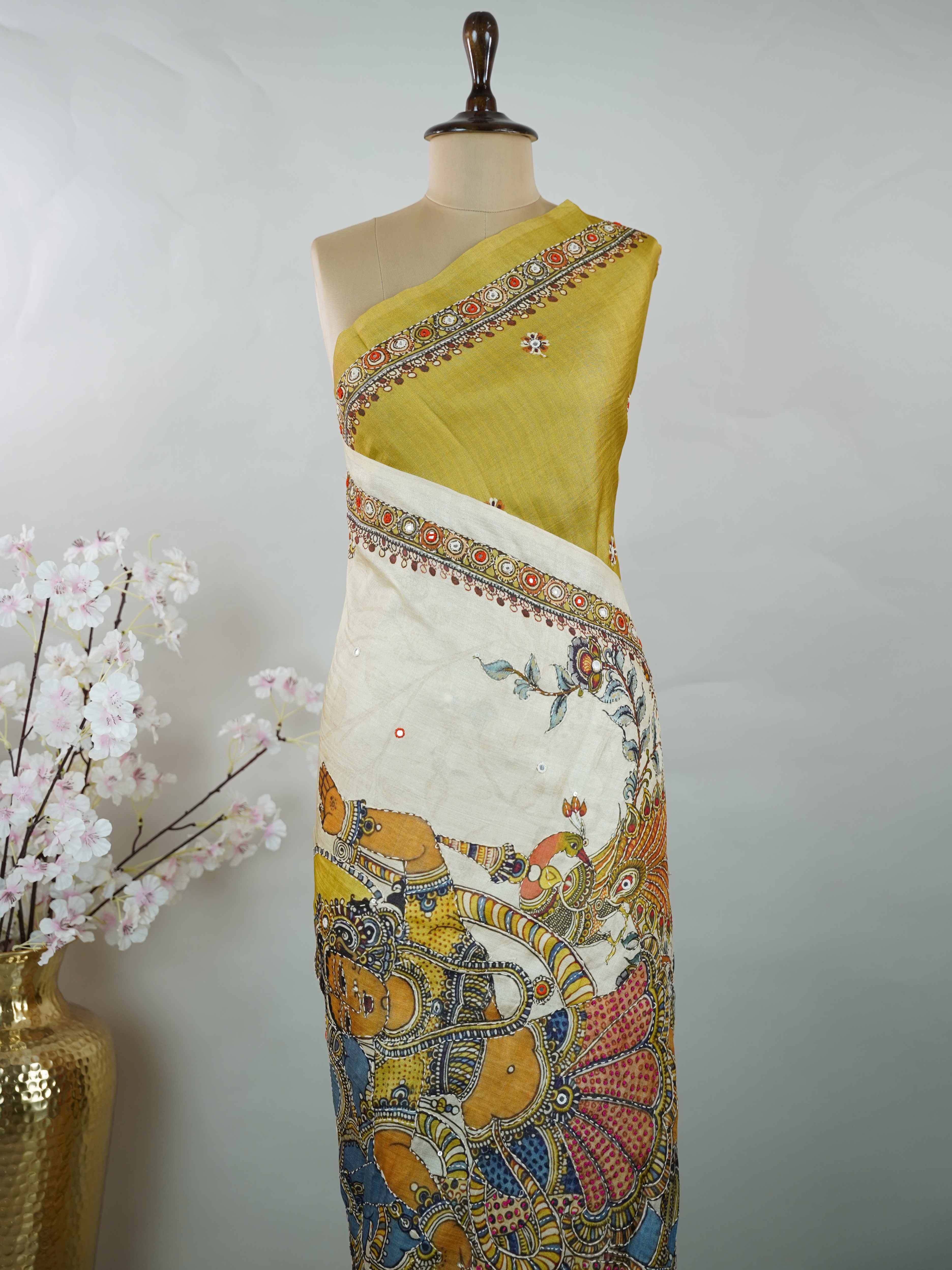 Tussar Mustard green Tussar silk body paired with a serene cream pallu and blouse, highlighted by intricate Radha Krishna embroidery.br
A graceful harmony of earthy vibrance and devotion, woven into timeless artistry. Narayani - Mustard Green Tussar Silk Saree | Radha Krishna Embroidery - Manoranjitham Weaves - Handloom Store