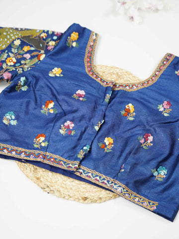 Tussar This elegant blue Tussar blouse features finely stitched hand embroidery work on both front and back. The intricate designs highlight rich craftsmanship with graceful and artistic detailing. The deep blue shade enhances the embroidery, giving it a bold and elegant appeal.br data-start=276 data-end=279Perfect for ethnic wear, it creates a stylish, refined, and beautifully handcrafted traditional look. Tanirika - Tussar Silk Saree | Hand Embroidered - Manoranjitham Weaves - Handloom Store