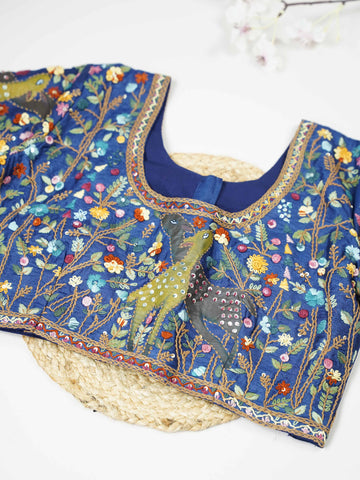 Tussar This elegant blue Tussar blouse features finely stitched hand embroidery work on both front and back. The intricate designs highlight rich craftsmanship with graceful and artistic detailing. The deep blue shade enhances the embroidery, giving it a bold and elegant appeal.br data-start=276 data-end=279Perfect for ethnic wear, it creates a stylish, refined, and beautifully handcrafted traditional look. Tanirika - Tussar Silk Saree | Hand Embroidered - Manoranjitham Weaves - Handloom Store