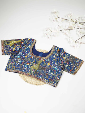 Tussar This elegant blue Tussar blouse features finely stitched hand embroidery work on both front and back. The intricate designs highlight rich craftsmanship with graceful and artistic detailing. The deep blue shade enhances the embroidery, giving it a bold and elegant appeal.br data-start=276 data-end=279Perfect for ethnic wear, it creates a stylish, refined, and beautifully handcrafted traditional look. Tanirika - Tussar Silk Saree | Hand Embroidered - Manoranjitham Weaves - Handloom Store