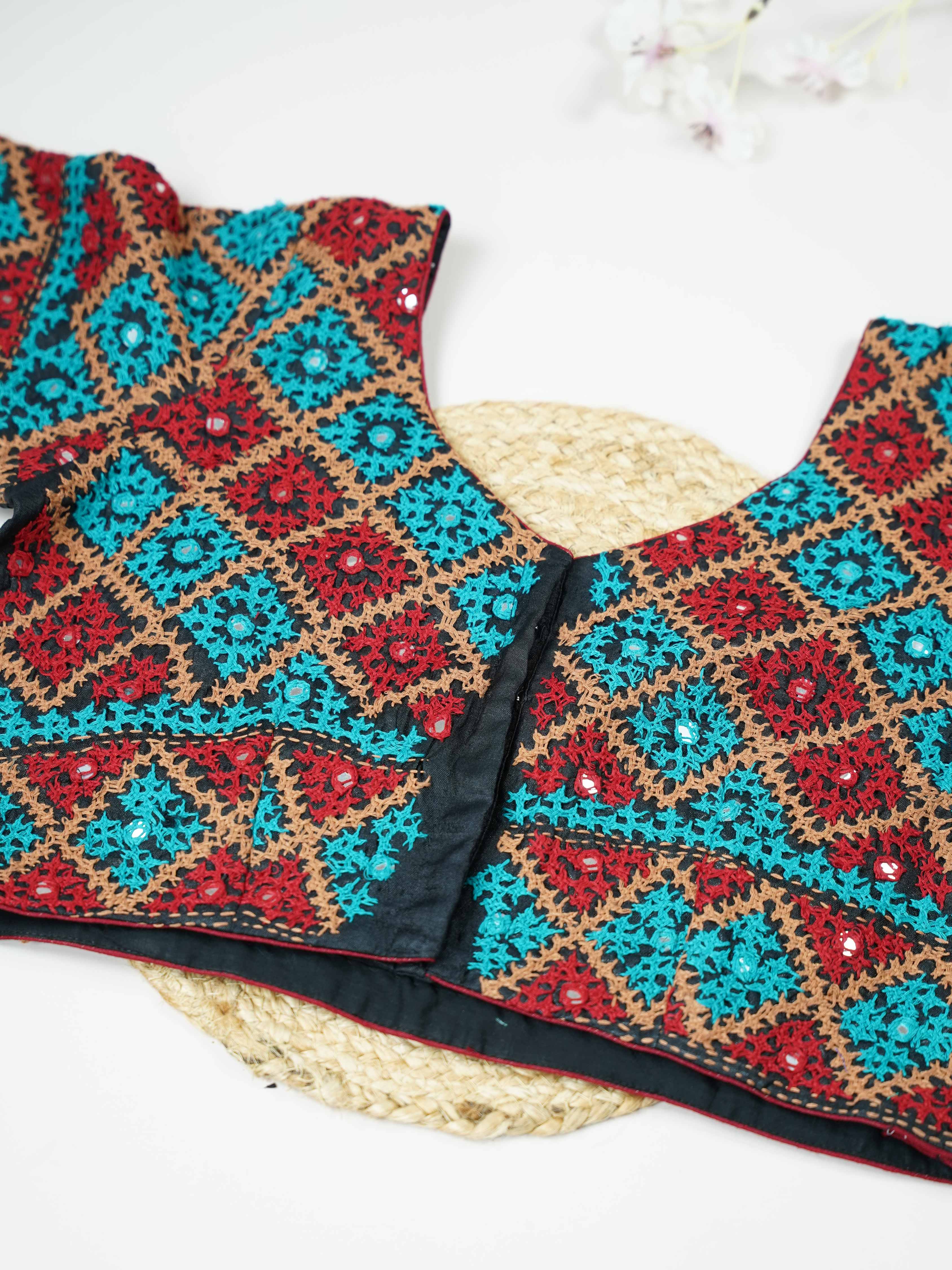 Tussar This elegant black Tussar blouse features finely stitched hand Kantha work across both front and back. The intricate embroidery showcases rich traditional craftsmanship with detailed artistic patterns. The deep black shade enhances the Kantha work, giving it a bold and timeless appeal. Perfect for ethnic wear, it creates a striking, elegant, and beautifully handcrafted traditional look Mrinalini - Tussar Silk Saree | Hand Embroidered - Manoranjitham Weaves - Handloom Store