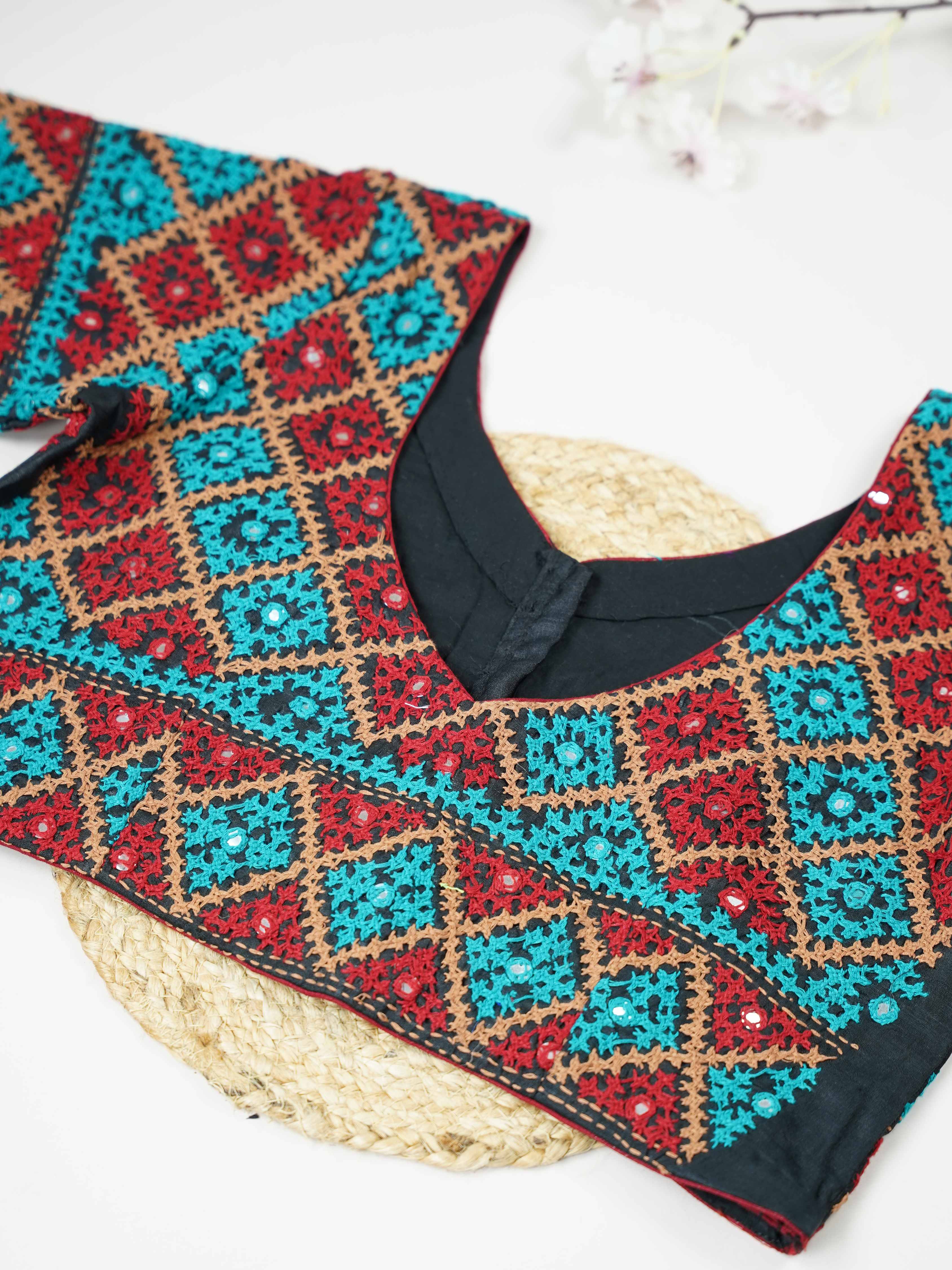 Tussar This elegant black Tussar blouse features finely stitched hand Kantha work across both front and back. The intricate embroidery showcases rich traditional craftsmanship with detailed artistic patterns. The deep black shade enhances the Kantha work, giving it a bold and timeless appeal. Perfect for ethnic wear, it creates a striking, elegant, and beautifully handcrafted traditional look Mrinalini - Tussar Silk Saree | Hand Embroidered - Manoranjitham Weaves - Handloom Store