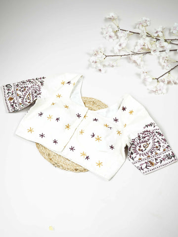 Tussar This elegant white Tussar blouse features finely stitched hand embroidery work.br data-start=79 data-end=82The delicate embroidery adds subtle texture and graceful handcrafted detailing.br data-start=161 data-end=164The classic white shade enhances the intricate work with a pure and timeless appeal.br data-start=248 data-end=251Perfect for ethnic wear, it creates a simple, elegant, and beautifully traditional look. Aadhira - Tussar Silk Saree | Hand Embroidered - Manoranjitham Weaves - Handloom Store