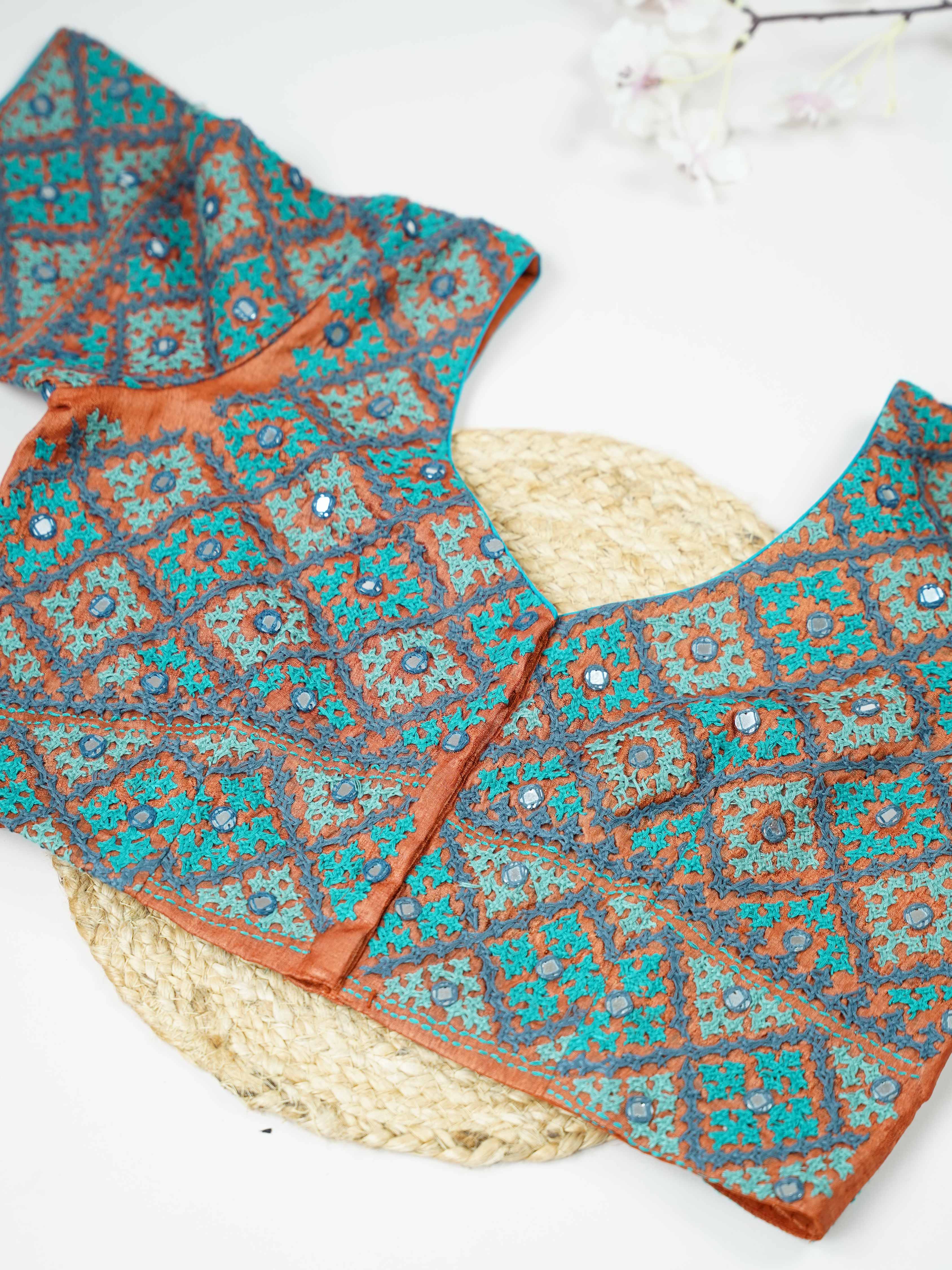 Tussar This elegant orange Tussar blouse features finely stitched hand Kantha work in a full design.br data-start=93 data-end=96The intricate Kantha embroidery covers the blouse beautifully, showcasing rich traditional craftsmanship. The vibrant orange shade enhances the detailed stitching with a bright and festive appeal. Perfect for ethnic wear, it creates a bold, artistic, and gracefully handcrafted traditional look. Devanshi - Tussar Silk Saree | Hand Embroidered - Manoranjitham Weaves - Handloom Store