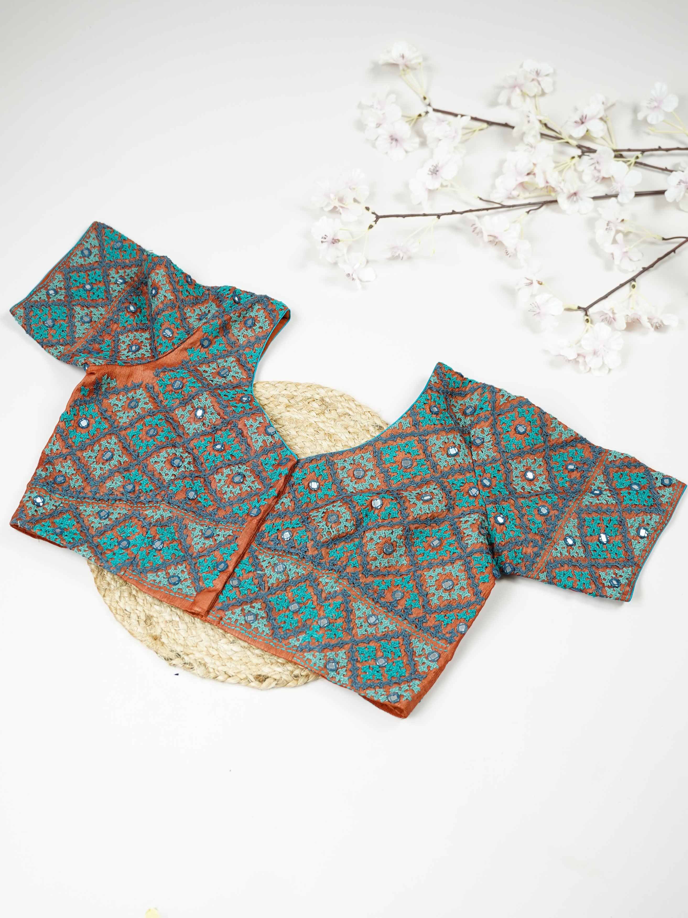 Tussar This elegant orange Tussar blouse features finely stitched hand Kantha work in a full design.br data-start=93 data-end=96The intricate Kantha embroidery covers the blouse beautifully, showcasing rich traditional craftsmanship. The vibrant orange shade enhances the detailed stitching with a bright and festive appeal. Perfect for ethnic wear, it creates a bold, artistic, and gracefully handcrafted traditional look. Devanshi - Tussar Silk Saree | Hand Embroidered - Manoranjitham Weaves - Handloom Store