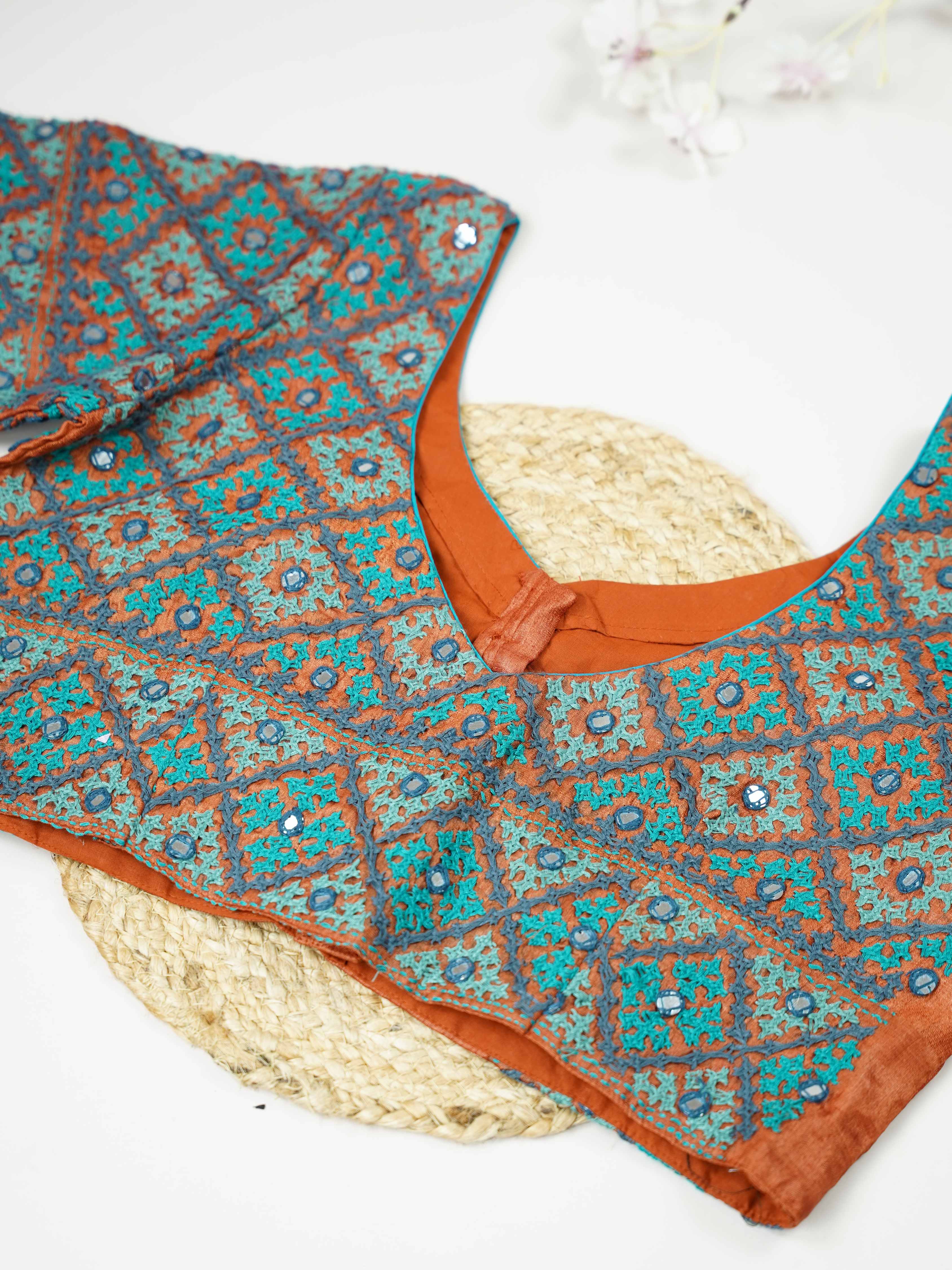 Tussar This elegant orange Tussar blouse features finely stitched hand Kantha work in a full design.br data-start=93 data-end=96The intricate Kantha embroidery covers the blouse beautifully, showcasing rich traditional craftsmanship. The vibrant orange shade enhances the detailed stitching with a bright and festive appeal. Perfect for ethnic wear, it creates a bold, artistic, and gracefully handcrafted traditional look. Devanshi - Tussar Silk Saree | Hand Embroidered - Manoranjitham Weaves - Handloom Store