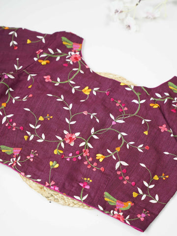 Tussar This elegant dark wine Tussar designer blouse features finely stitched contrast hand embroidery work. The front and back are fully adorned with rich embroidery, showcasing detailed craftsmanship. The deep wine shade enhances the intricate design, giving it a regal and graceful appeal. Perfect for ethnic wear, it creates a bold, stylish, and beautifully handcrafted traditional look. Shobhita - Tussar Silk Saree | Hand Embroidered - Manoranjitham Weaves - Handloom Store