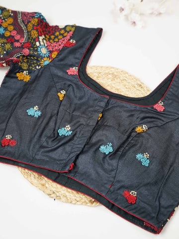 Tussar This elegant black Tussar designer blouse features finely stitched contrast hand Kantha work.br data-start=93 data-end=96The front is adorned with small floral motifs, adding a subtle yet graceful charm.br data-start=178 data-end=181The back is fully detailed with rich Kantha embroidery, showcasing intricate craftsmanship.br data-start=272 data-end=275Perfect for ethnic wear, it creates a bold, stylish, and beautifully balanced traditional look. Alankrita - Tussar Silk Saree | Hand Embroidered - Mano