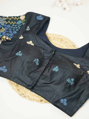 Tussar This elegant black Tussar designer blouse features beautifully stitched contrast hand embroidery work. The front is adorned with small floral motifs, adding a subtle yet graceful charm. The back is richly designed with full embroidery, showcasing intricate craftsmanship.br data-start=275 data-end=278Perfect for ethnic wear, it creates a bold, stylish, and eye-catching traditional look. Avarni - Tussar Silk Saree | Hand Embroidered - Manoranjitham Weaves - Handloom Store
