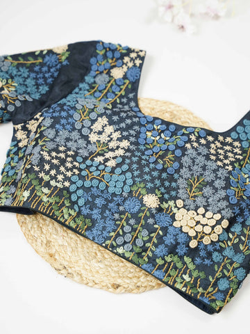 Tussar This elegant black Tussar designer blouse features beautifully stitched contrast hand embroidery work. The front is adorned with small floral motifs, adding a subtle yet graceful charm. The back is richly designed with full embroidery, showcasing intricate craftsmanship.br data-start=275 data-end=278Perfect for ethnic wear, it creates a bold, stylish, and eye-catching traditional look. Avarni - Tussar Silk Saree | Hand Embroidered - Manoranjitham Weaves - Handloom Store
