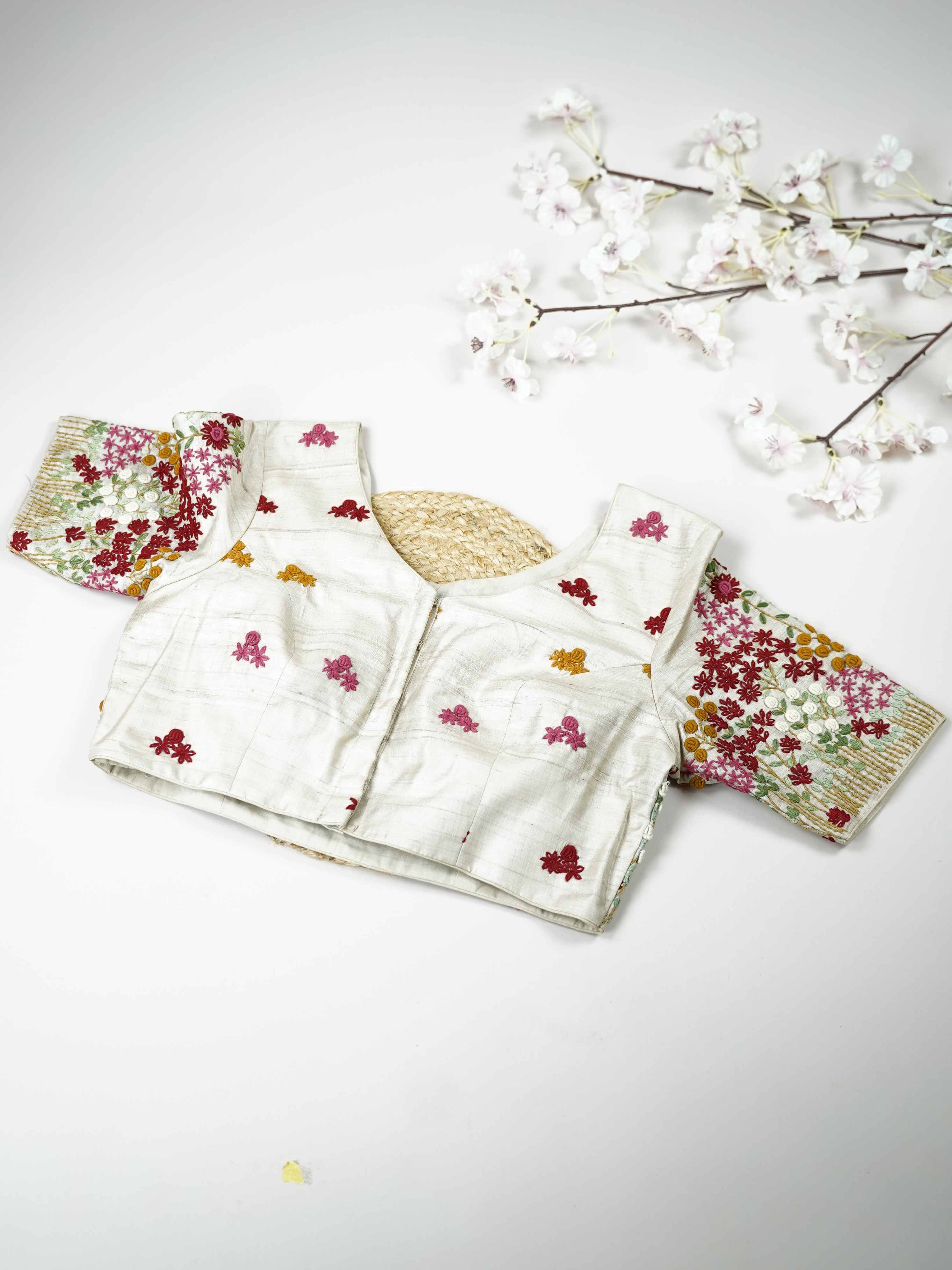 Tussar This elegant white Tussar blouse features finely stitched hand Kantha work that reflects traditional craftsmanship. The delicate embroidery adds subtle texture and artistic charm to the soft fabric. Its classic white shade enhances the intricate Kantha detailing with a graceful appeal. Perfect for pairing with ethnic sarees, it offers a timeless and elegant traditional look. Inara - Tussar Silk Saree | Hand Embroidered - Manoranjitham Weaves - Handloom Store