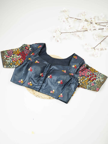 Tussar This elegant black Tussar blouse features finely stitched hand embroidery work.br data-start=79 data-end=82The front is delicately designed with small floral motifs, adding a subtle and graceful charm. Arinya - Tussar Silk Saree | Hand Embroidered - Manoranjitham Weaves - Handloom Store