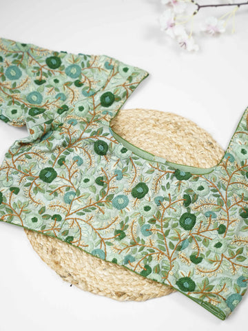 Tussar This elegant mint green Tussar designer blouse features finely stitched hand embroidery work. The front is adorned with small floral motifs, adding a soft and graceful charm.br data-start=176 data-end=179The back is fully detailed with rich embroidery, showcasing intricate craftsmanship.br data-start=263 data-end=266Perfect for ethnic wear, it creates a stylish, refreshing, and beautifully balanced traditional look. Komala - Tussar Silk Saree | Hand Embroidered - Manoranjitham Weaves - Handloom Store