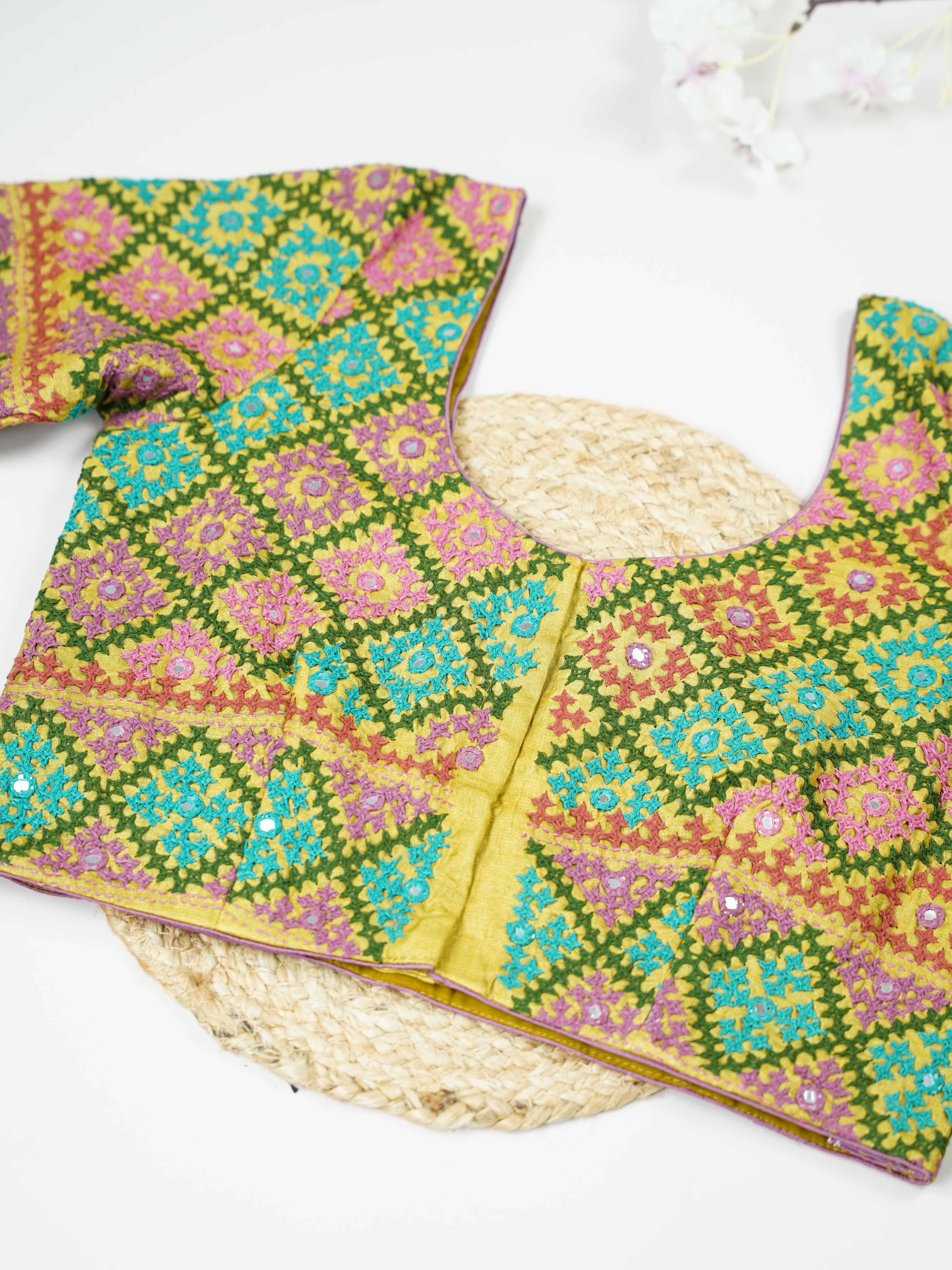 Tussar This elegant light yellow Tussar blouse features finely stitched hand Kantha work. Both the front and back are fully adorned with intricate embroidery, showcasing rich craftsmanship. The soft yellow shade enhances the detailed Kantha patterns with a fresh and graceful appeal. Perfect for ethnic wear, it creates a bright, elegant, and beautifully handcrafted look. Ruchira - Tussar Silk Saree | Hand Embroidered - Manoranjitham Weaves - Handloom Store