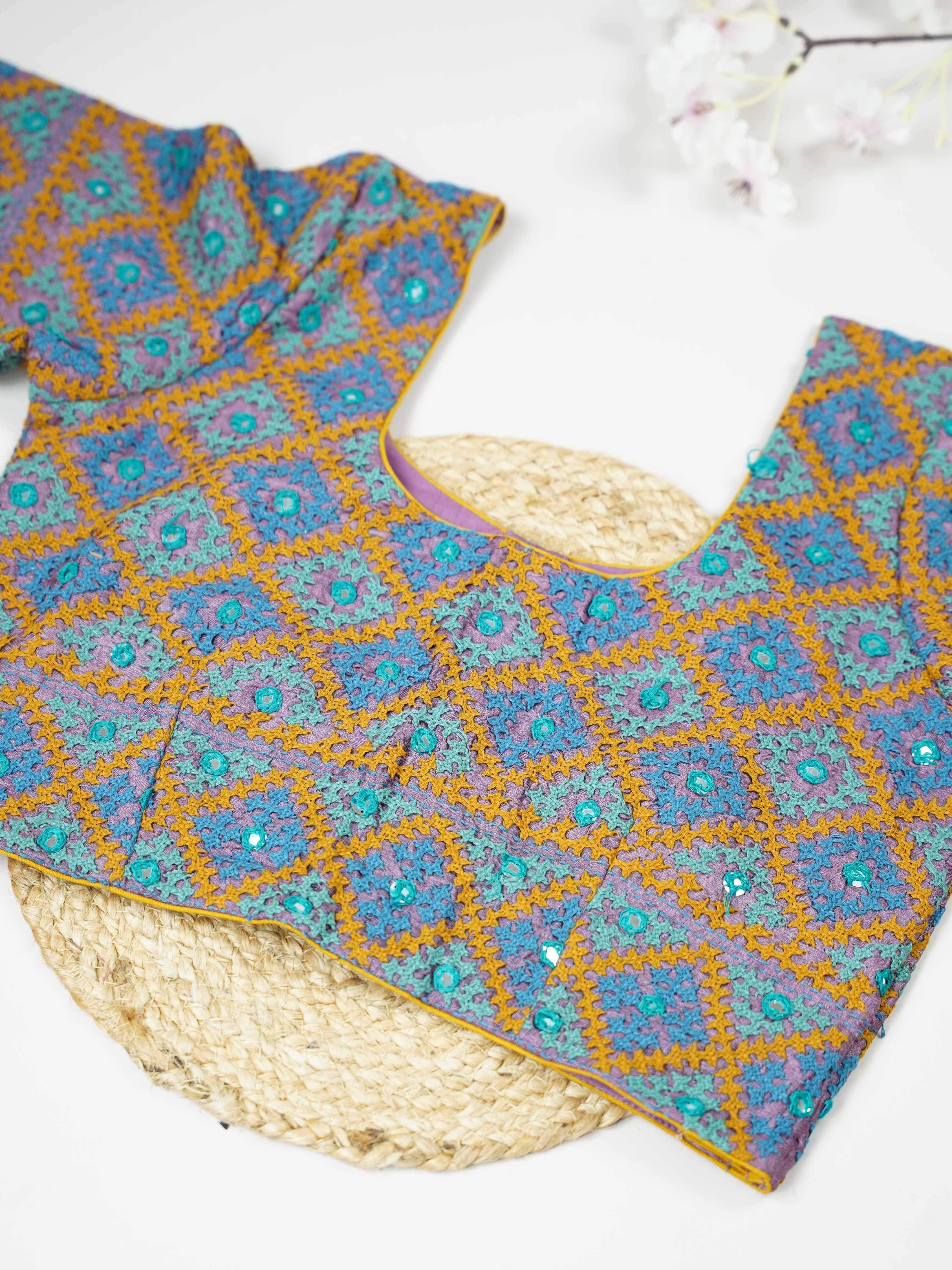 Tussar This elegant blue Tussar blouse features finely stitched hand Kantha work across both front and back. The intricate embroidery adds rich texture and showcases traditional craftsmanship beautifully. Its deep blue shade enhances the detailed Kantha design with a graceful and striking appeal. Perfect for ethnic wear, it offers a complete and stylish handcrafted look from every angle. Sukanya - Tussar Silk Saree | Hand Embroidered - Manoranjitham Weaves - Handloom Store