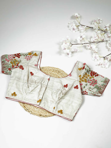 Tussar This elegant off-white Tussar blouse features finely stitched hand embroidery work.br data-start=83 data-end=86The front is adorned with small floral motifs, adding a subtle and graceful charm.br data-start=168 data-end=171The back is richly detailed with full embroidery, showcasing intricate craftsmanship.br data-start=256 data-end=259Perfect for ethnic wear, it offers a timeless and beautifully balanced traditional look. Vinyasa - Tussar Silk Saree | Hand Embroidered - Manoranjitham Weaves - Handlo