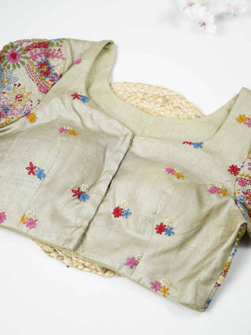 Tussar This elegant light green Tussar blouse features finely stitched hand Kantha work.br data-start=81 data-end=84The front is delicately designed with small floral motifs, adding a subtle graceful charm.br data-start=174 data-end=177The back is fully adorned with detailed Kantha embroidery, showcasing rich traditional artistry. Perfect for ethnic wear, it creates a refreshing, elegant, and beautifully balanced traditional look. Anaira - Tussar Silk Saree | Hand Embroidered - Manoranjitham Weaves - Handlo