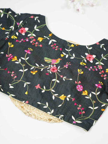 Tussar This elegant black Tussar blouse features finely stitched hand embroidery work.br data-start=79 data-end=82The front and back are beautifully decorated with delicate floral designs, adding timeless charm. The intricate flower motifs highlight rich craftsmanship and elegant traditional artistry. Perfect for ethnic wear, it creates a bold, graceful, and stylish traditional look Vihana - Tussar Silk Saree | Hand Embroidered - Manoranjitham Weaves - Handloom Store