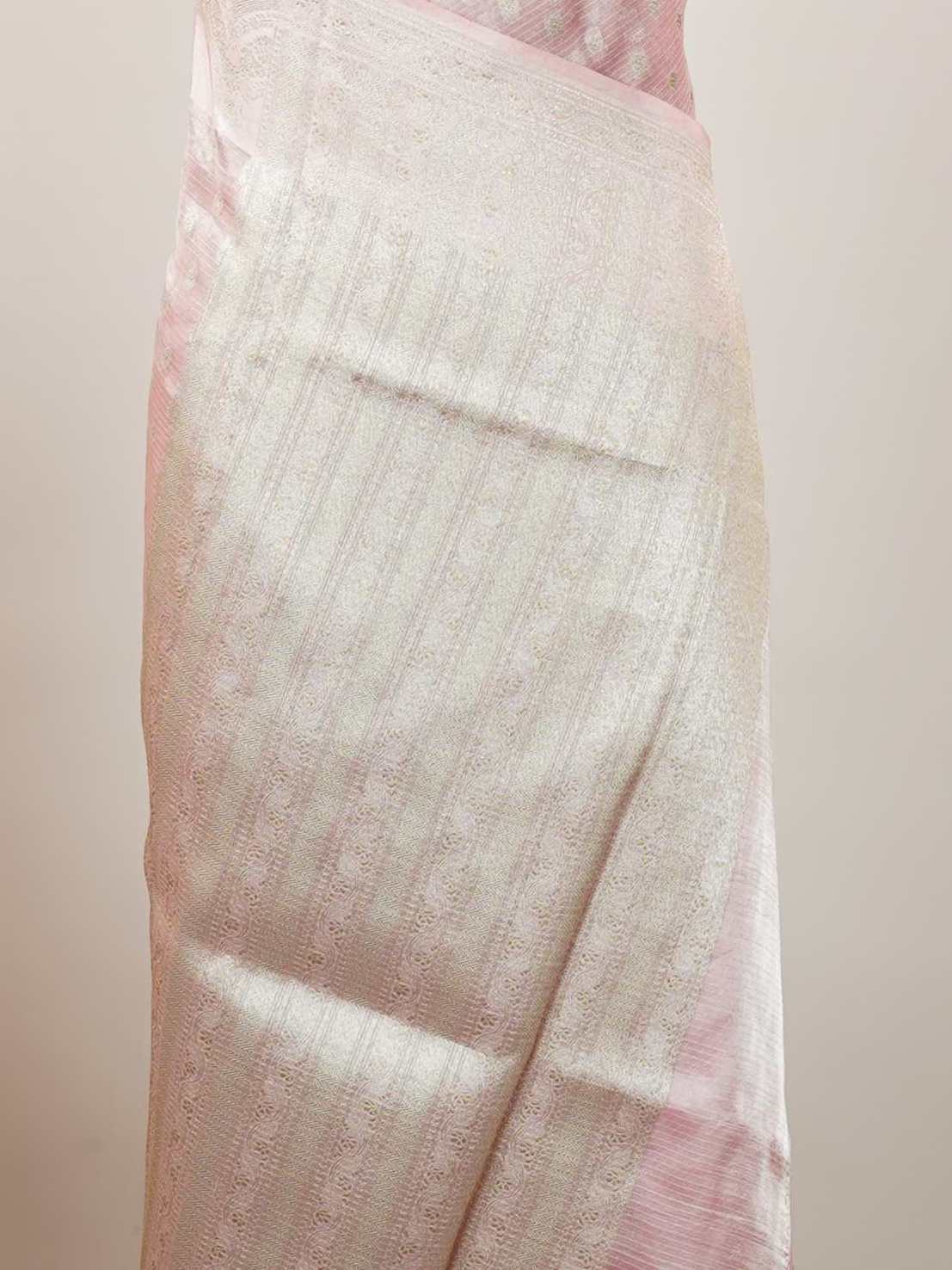 Tissue A Tissue saree is the perfect blend of delicate silk and shimmering zari, woven to create an ethereal, translucent fabric that sparkles with every movement. Lightweight and luxurious, it’s ideal for grand occasions and celebrations where elegance is key. Draped in a Tissue saree, you embody timeless glamour with a modern twist. Abhogi - Banarasi Tissue Kora Saree - Manoranjitham Weaves - Handloom Store