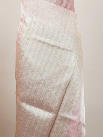 Tissue A Tissue saree is the perfect blend of delicate silk and shimmering zari, woven to create an ethereal, translucent fabric that sparkles with every movement. Lightweight and luxurious, it’s ideal for grand occasions and celebrations where elegance is key. Draped in a Tissue saree, you embody timeless glamour with a modern twist. Abhogi - Banarasi Tissue Kora Saree - Manoranjitham Weaves - Handloom Store