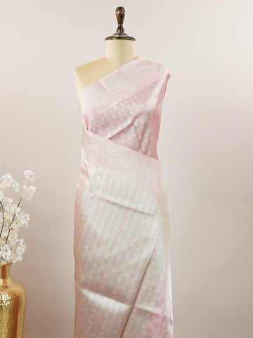 Tissue A Tissue saree is the perfect blend of delicate silk and shimmering zari, woven to create an ethereal, translucent fabric that sparkles with every movement. Lightweight and luxurious, it’s ideal for grand occasions and celebrations where elegance is key. Draped in a Tissue saree, you embody timeless glamour with a modern twist. Abhogi - Banarasi Tissue Kora Saree - Manoranjitham Weaves - Handloom Store
