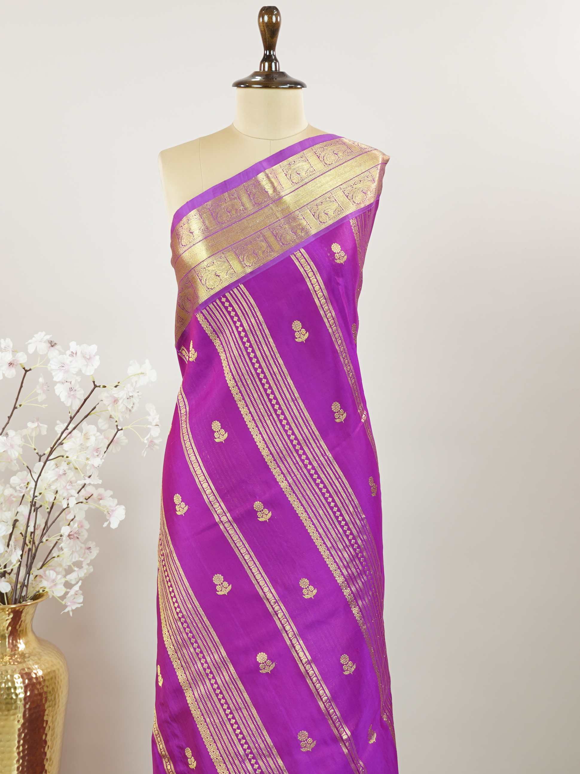 Venkatagiri Silk Woven in the heart of Andhra Pradesh, this Venkatagiri handloom saree is a symbol of regal elegance and heritage. Known for its soft texture and intricate craftsmanship, it drapes gracefully for weddings, pujas, and festive moments. Each thread carries tradition, making it a cherished piece of South Indian artistry. Lightweight yet luxurious — a true sree in every sense. Kavana - Venkatagiri  saree - Manoranjitham Weaves - Handloom Store