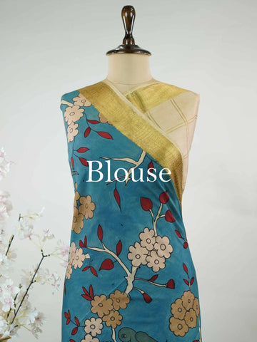 Mysore silk Pure Mysore silk saree featuring classic zari checks paired with intricate hand-drawn pen Kalamkari.br
A striking blend of structured elegance and storytelling artistry, where tradition meets timeless design. Nitye - Pure Mysore Silk Saree | Pen Kalamkari - Manoranjitham Weaves - Handloom Store