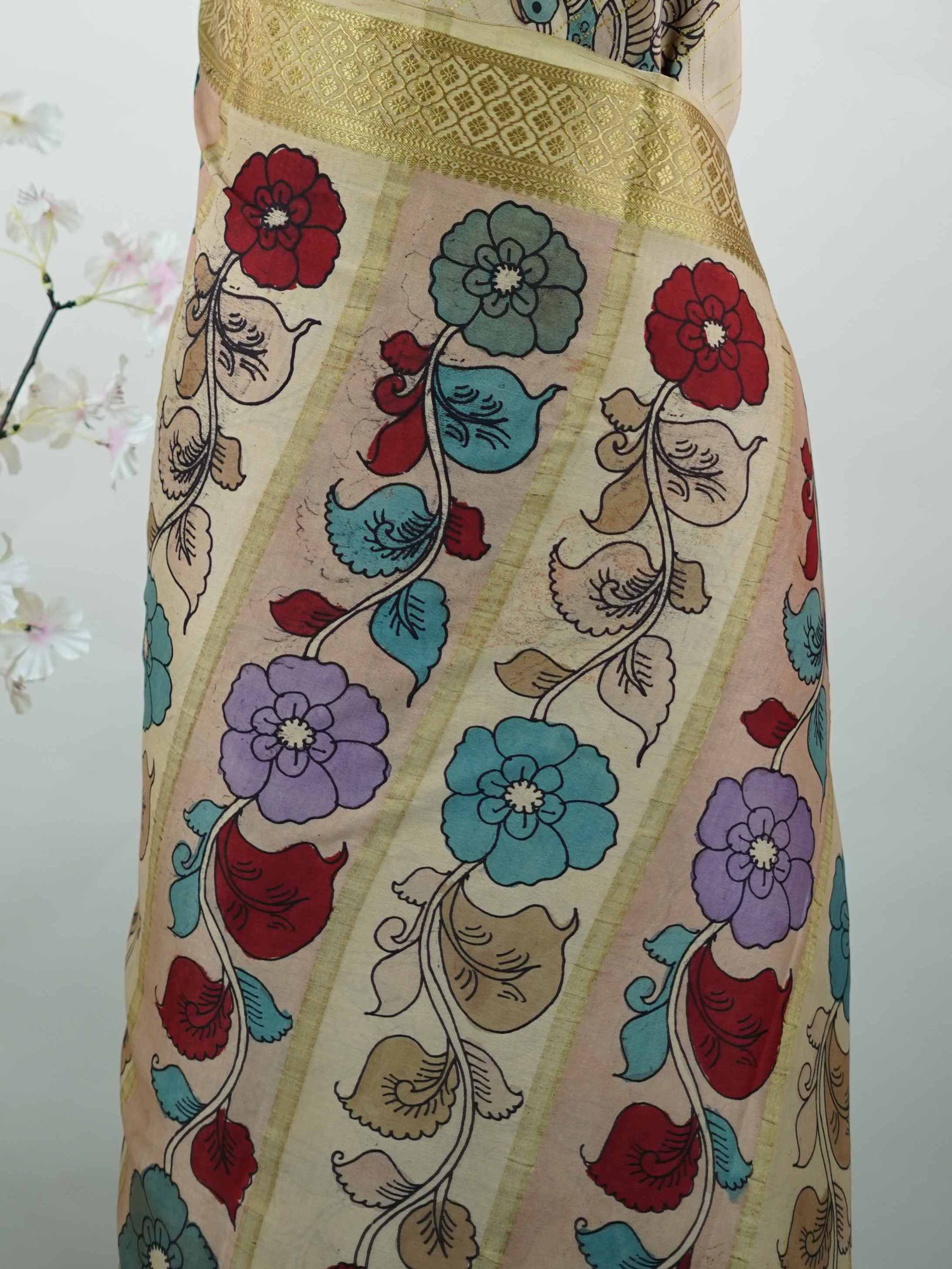 Mysore silk Pure Mysore silk saree featuring classic zari checks paired with intricate hand-drawn pen Kalamkari.br
A striking blend of structured elegance and storytelling artistry, where tradition meets timeless design. Neelapathake - Pure Mysore Silk Saree | Pen Kalamkari - Manoranjitham Weaves - Handloom Store