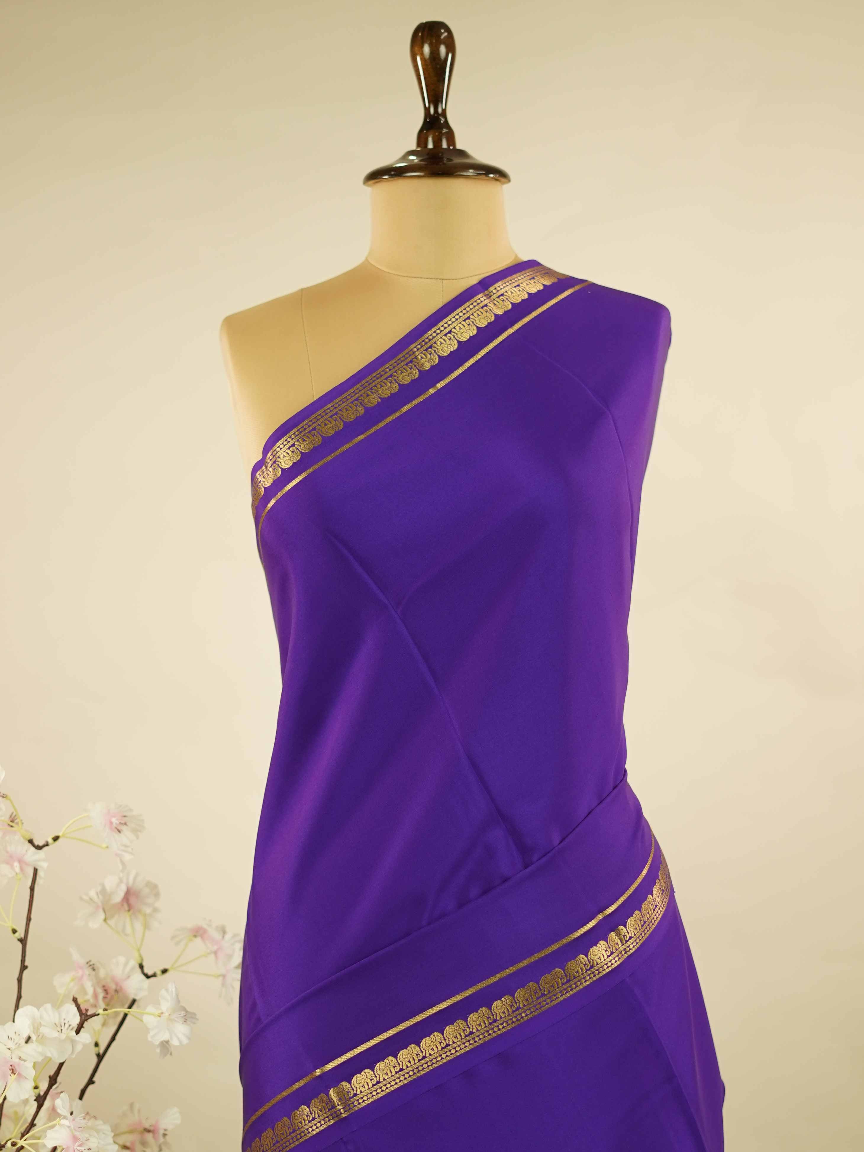 Mysore silk Plain Mysore silk saree accented with delicate small elephant borders.br
A subtle statement of heritage and elegance, woven into timeless simplicity. Kaumari - Pure Mysore Silk Saree | Elephant Border - Manoranjitham Weaves - Handloom Store